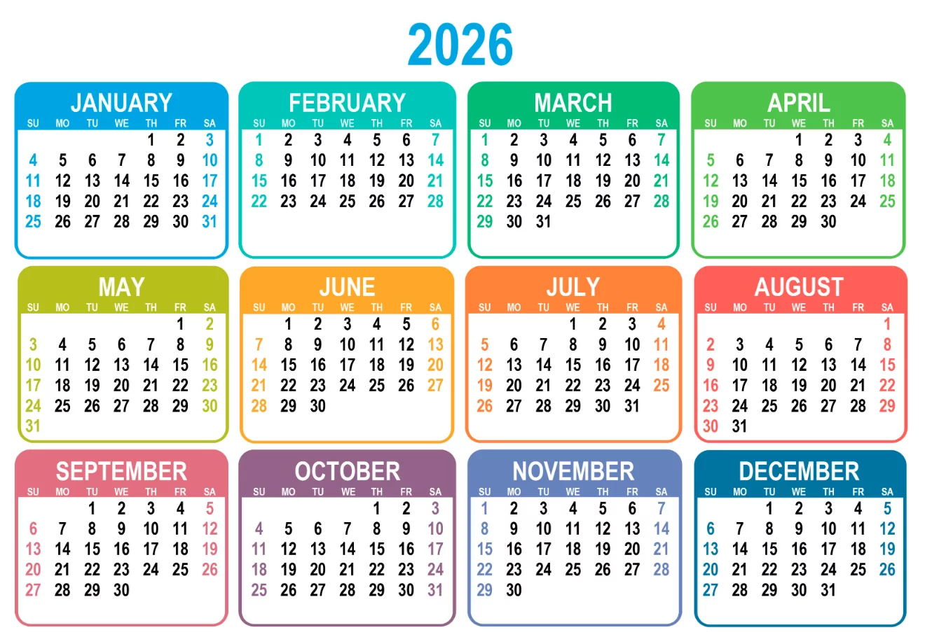 An organized desk showing a printed 2026 calendar with highlighted week numbers for project planning