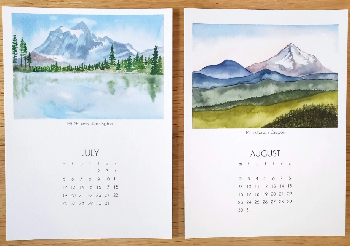 Artistic 2026 wall calendar with watercolor illustrations on wall